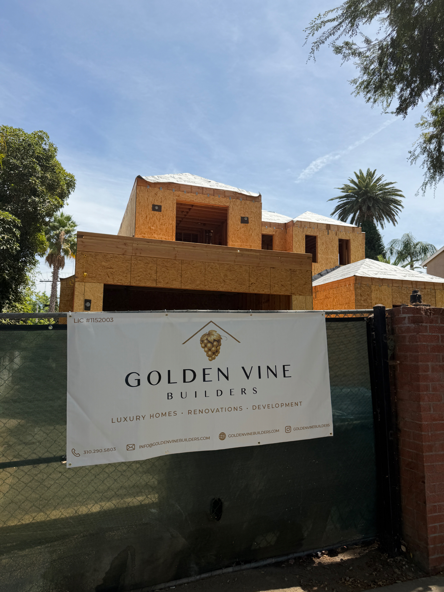 New Golden Vine Builders residence under construction in Sherman Oaks with branded site banner